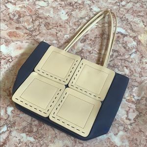 Canvas purse with leather paneled detail